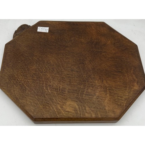 183 - An oak Peter Rabbitman Heap bread board. 31 x 25cm.