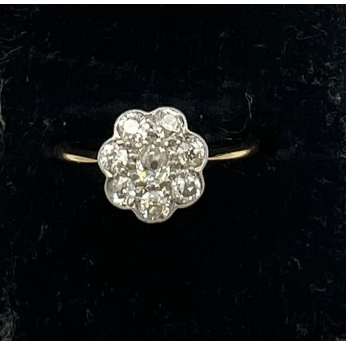 468 - An 18 carat gold diamond cluster ring, size I. Weight 2gm.