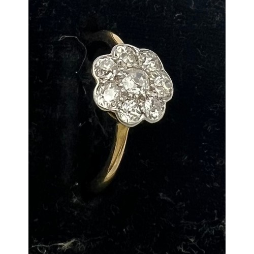 468 - An 18 carat gold diamond cluster ring, size I. Weight 2gm.