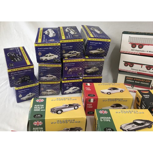 930 - A collection of boxed toy cars, buses and trucks to include 12x Eddie Stobart, 6x classic sports car... 