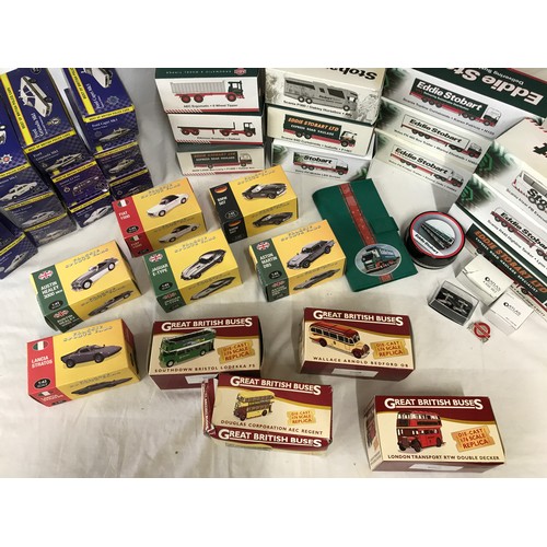 930 - A collection of boxed toy cars, buses and trucks to include 12x Eddie Stobart, 6x classic sports car... 