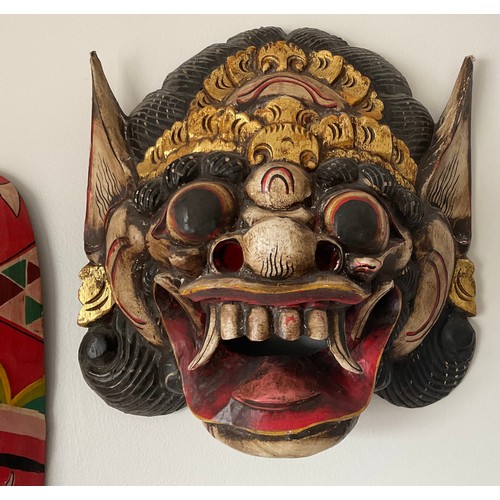 1254 - Eleven various wooden wall masks, dragon boat 96 w x 30cm h. One resin.