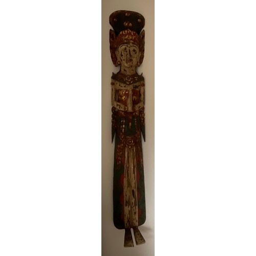 1255 - An Asian wooden wall mounted figure of a female. 150cm h.