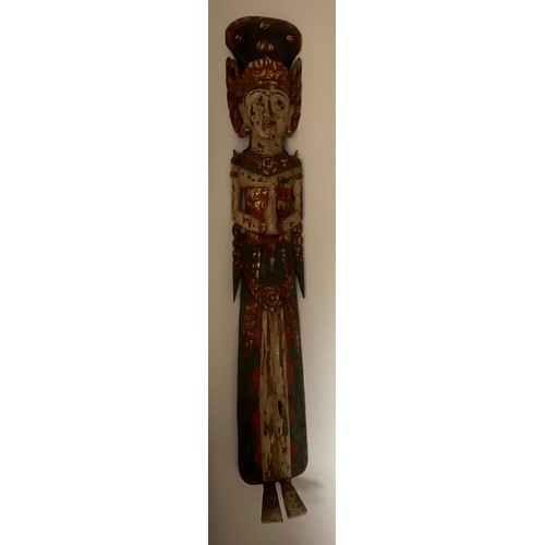 1255 - An Asian wooden wall mounted figure of a female. 150cm h.