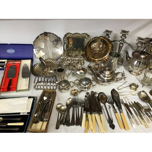 781 - A large collection of silverplate and pewter items to include trays, teapots, jugs, knives, forks an... 