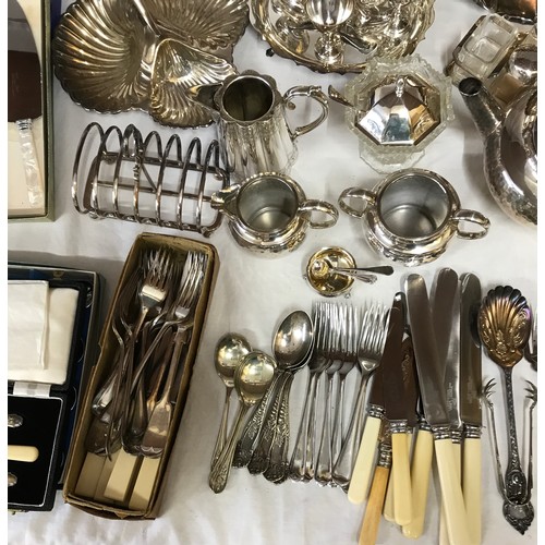 781 - A large collection of silverplate and pewter items to include trays, teapots, jugs, knives, forks an... 