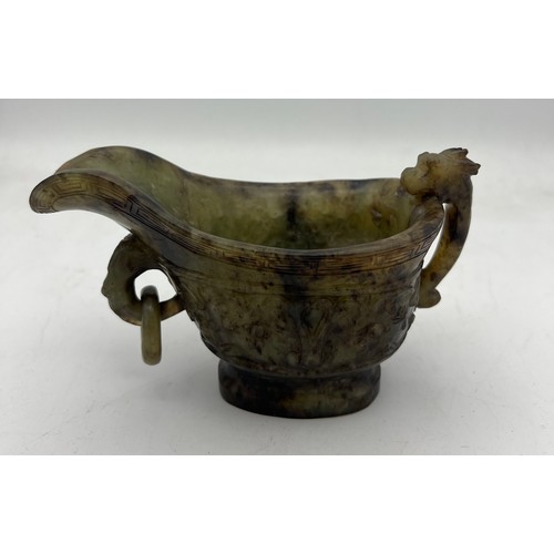 887 - A Chinese Qing spinach green and russet jade Archaistic pouring vessel Yi. 9cm h.