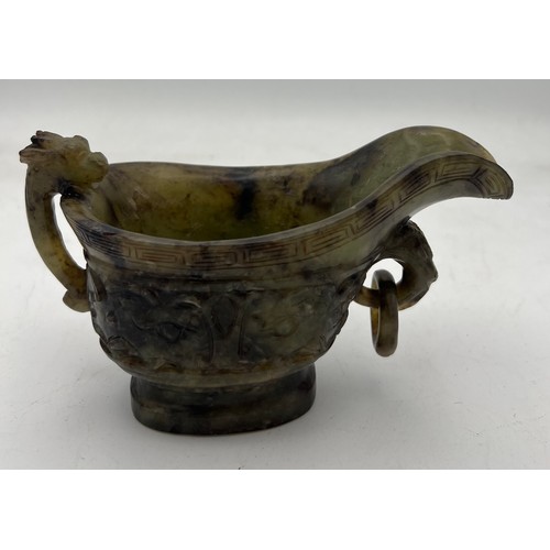 887 - A Chinese Qing spinach green and russet jade Archaistic pouring vessel Yi. 9cm h.