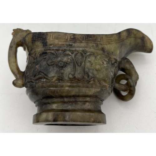 887 - A Chinese Qing spinach green and russet jade Archaistic pouring vessel Yi. 9cm h.