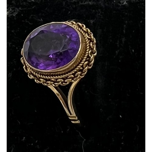 474 - A 9 carat gold ring set with amethyst. Size L. Weight 2.9gm.