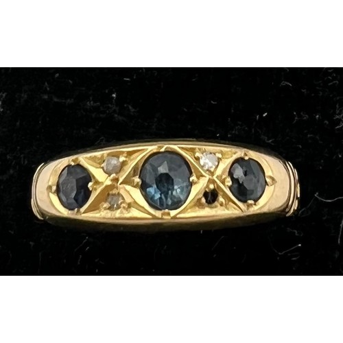 476 - An 18 carat ring set with 3 sapphires and diamonds. One diamond missing. Size R. Weight 2.5gm.