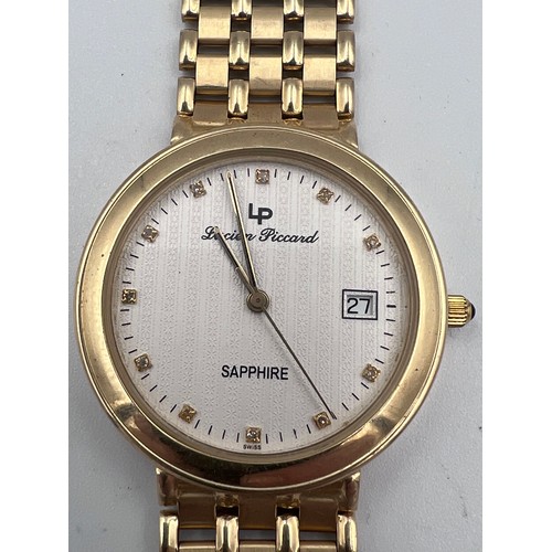 640 - A 14 carat Lucien Piccard watch on 14 carat gold bracelet. Case: 33mm. Back of case stamped 14K 0.58... 