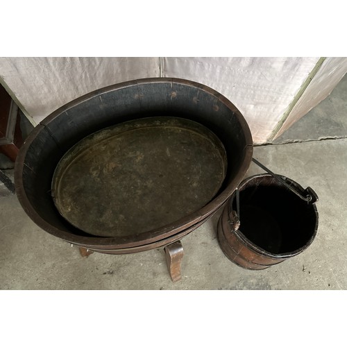 1269 - A coopered oval wooden planter 56cm x 43.5 x 62 h. with metal liner together with a wooden bucket.