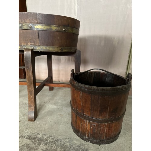 1269 - A coopered oval wooden planter 56cm x 43.5 x 62 h. with metal liner together with a wooden bucket.