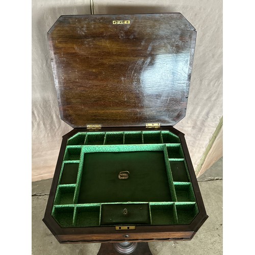 164 - A 19thC rosewood sewing table with fitted interior on lion’s paw feet and castors. 44cm w x 37 d x 7... 