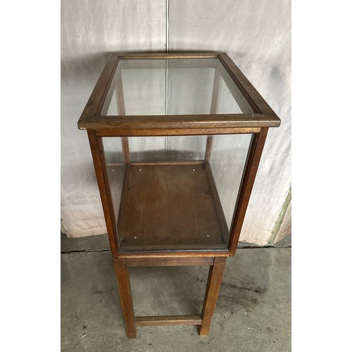 166 - An oak glazed display cabinet with lift off lid. 97cm h x 37.5 d x 49.5 h.