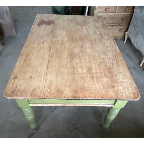 171 - A pine kitchen table with drawer to one end on brass castors. 153.5cm l x 96.5 w x 73 h.