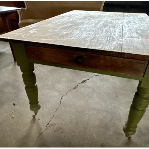 171 - A pine kitchen table with drawer to one end on brass castors. 153.5cm l x 96.5 w x 73 h.