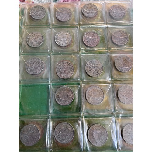 696 - A large folder collection of coins to include Sixpences, threepences, One Shillings, One Florins, Tw... 