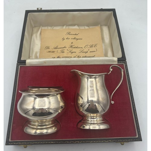 865 - A cased silver milk and sugar bowl Birmingham 1971/72, maker A.T. Cannon Ltd. Total weight 153.6gm.