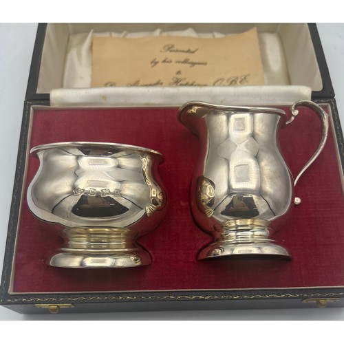 865 - A cased silver milk and sugar bowl Birmingham 1971/72, maker A.T. Cannon Ltd. Total weight 153.6gm.