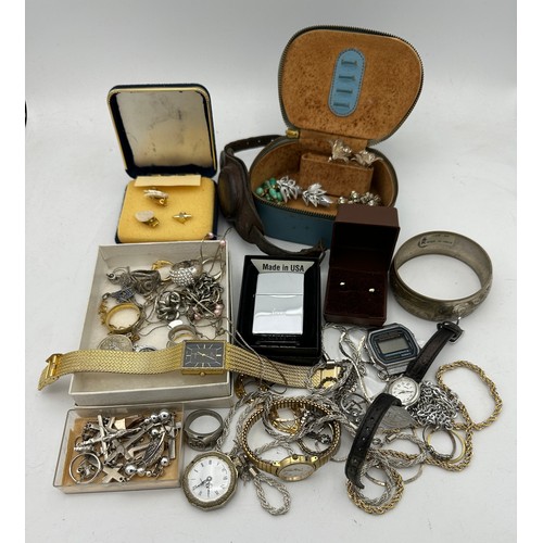 389 - A quantity of vintage costume jewellery to include Zippo lighter, rings, earrings etc.