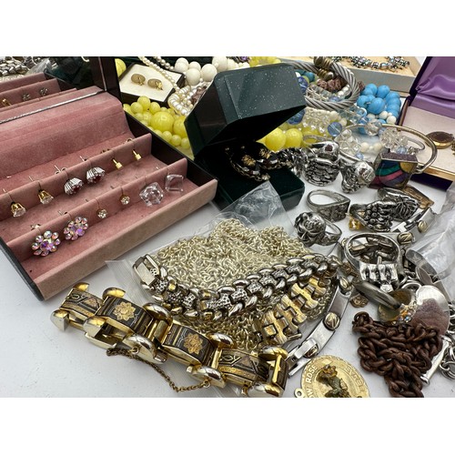 390 - A quantity of vintage costume jewellery to include necklaces, rings, bangles earrings etc.