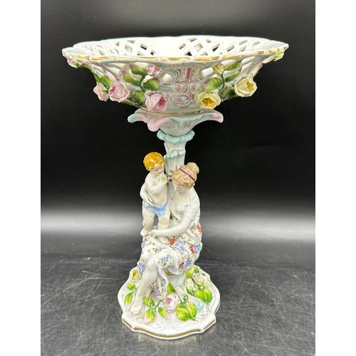 348 - A 19thC continental centrepiece with female and cherub to base and lattice work and floral decorated... 