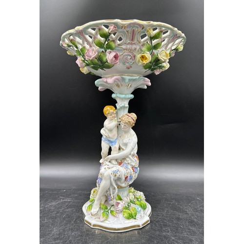 348 - A 19thC continental centrepiece with female and cherub to base and lattice work and floral decorated... 