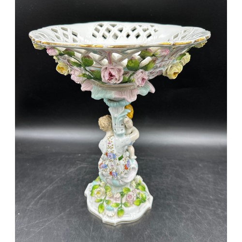 348 - A 19thC continental centrepiece with female and cherub to base and lattice work and floral decorated... 