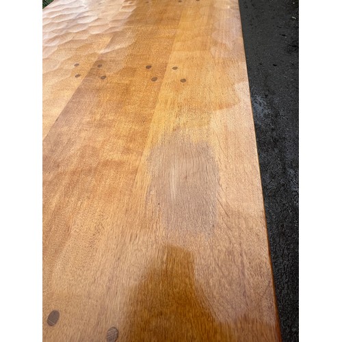 180 - A Robert Thompson Mouseman oak refectory dining table with adzed top. 182cm l x 86cm w x 73cm h.