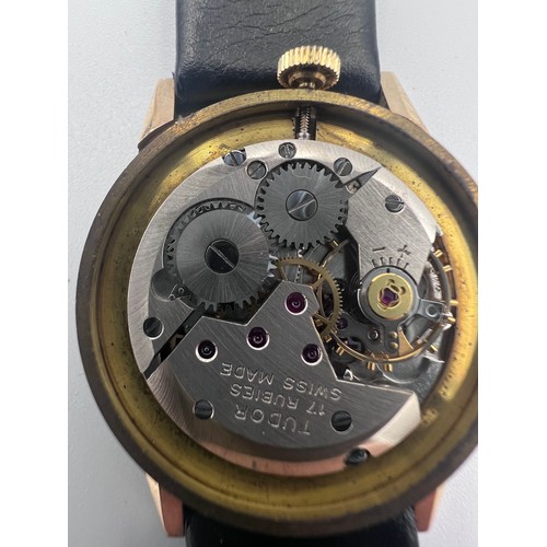 617 - A 9ct gold Rolex Tudor presentation watch on black leather Rolex strap. Presented to J.M. Platje by ... 