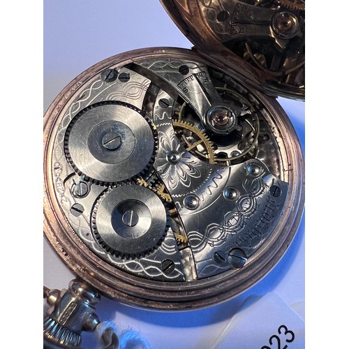 486 - A nine carat gold Waltham hunter pocket watch with white enamel dial and subsidiary second dial. Wei... 