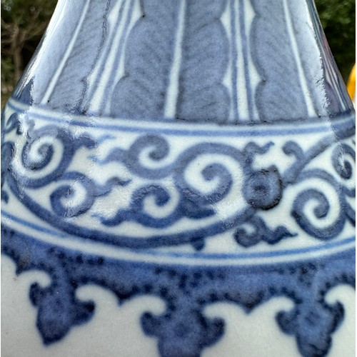 891 - A Chinese blue and white bottle vase, Guangxu mark and period. 29cm h.