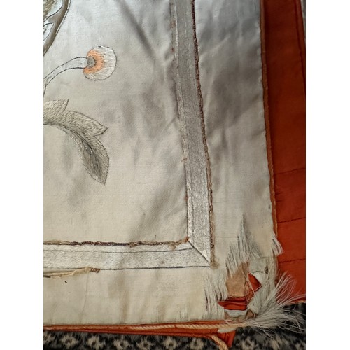 1064 - A large good quality Chinese silk embroidered panel with orange silk lining. Approx. 218 x 308cm.