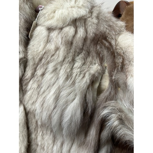 1056 - A vintage silver fox fur jacket. Nape to hem 74cm. Armpit to armpit 47cm.