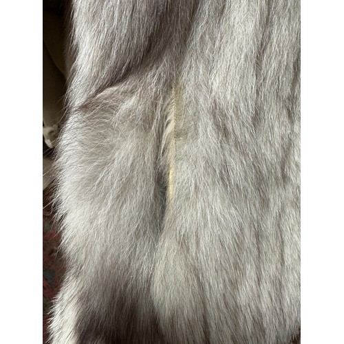 1056 - A vintage silver fox fur jacket. Nape to hem 74cm. Armpit to armpit 47cm.