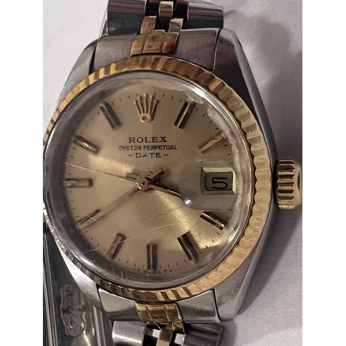 638A - A lady's Rolex oyster perpetual date stainless steel and gold colour automatic wristwatch. With red ... 