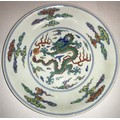 A pair of fine and rare doucai 'dragon' saucer dishes. Yongzheng six character mark and of the perio... 