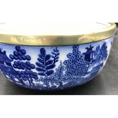 2 - A Mintons blue and white bowl decorated in the willow pattern with white metal collar around rim, 24... 