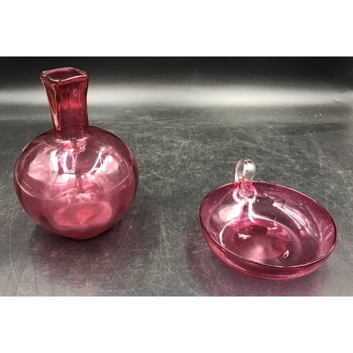 5 - Two pieces of cranberry glass, one vase 17cm h and one shallow bowl with handle 14cm d along with a ... 