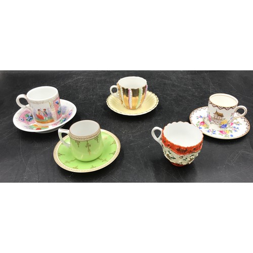 11 - Four various ceramic coffee cans and saucers and additional can to include one Aynsley set and other... 