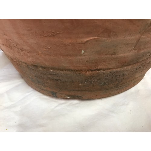 18 - A large twin handled terracotta vase with glazed interior. 49 h x 42cm w approx.