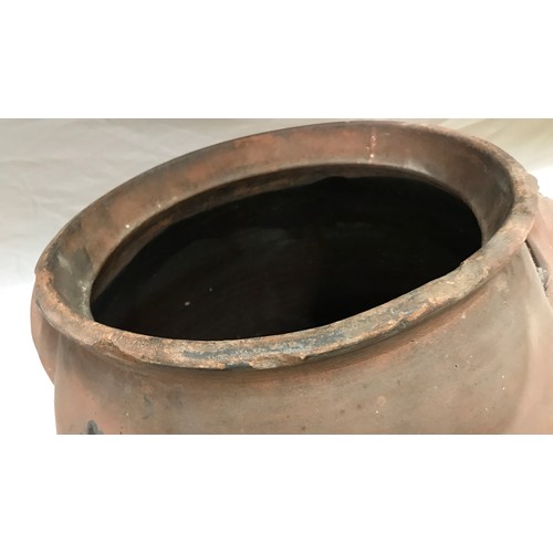 18 - A large twin handled terracotta vase with glazed interior. 49 h x 42cm w approx.