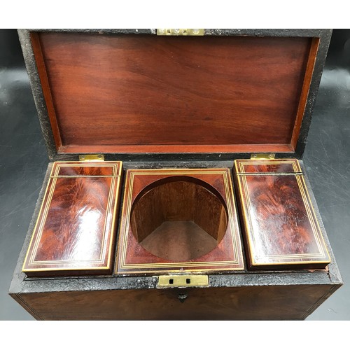 28 - A Georgian mahogany tea caddy with string inlay and two lidded removable compartments inside.