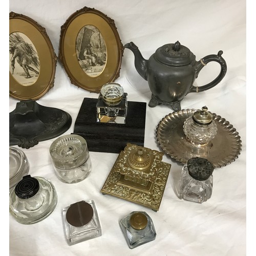 32 - A collection of various inkwells some with wooden bases, silverplate and brass along with a wooden w... 