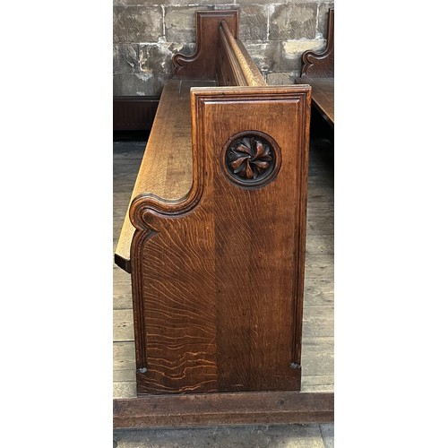 139 - A 19thC oak pew with floral roundel to one end by Sir George Gilbert Scott. 244 L x 96h x 52cm d.

P... 