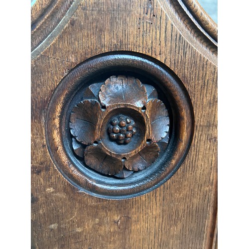 139 - A 19thC oak pew with floral roundel to one end by Sir George Gilbert Scott. 244 L x 96h x 52cm d.

P... 