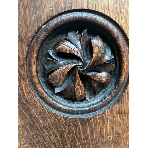 139 - A 19thC oak pew with floral roundel to one end by Sir George Gilbert Scott. 244 L x 96h x 52cm d.

P... 