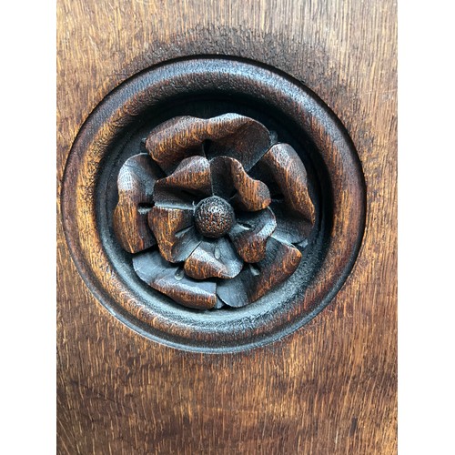 140 - A 19thC oak pew with floral roundel to one end by Sir George Gilbert Scott. 244 L x 96h x 52cm d.

P... 